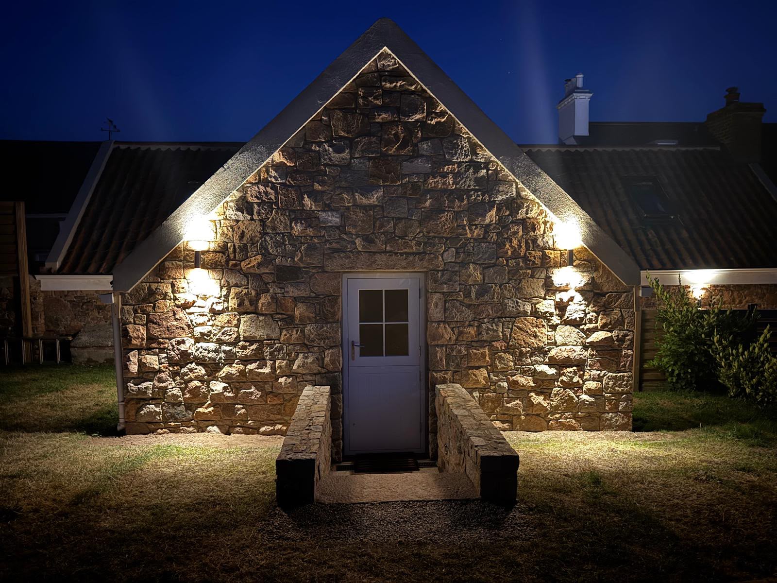 Lit Stone Gable at Night